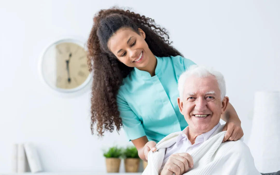 Caregiver assisting elderly patient
